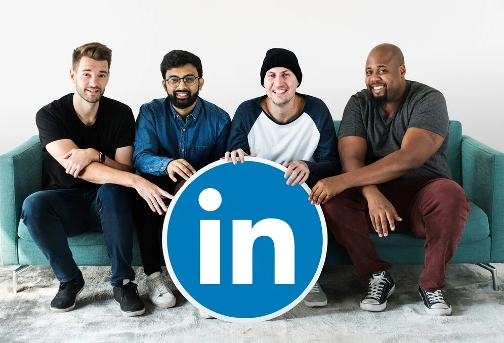 people-holding-linkedin-logo_53876-41327